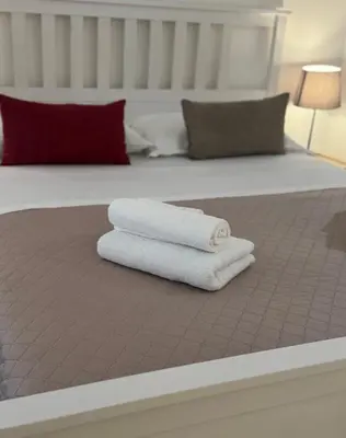 Letto o letti in una camera di Qori Sicilian Stay