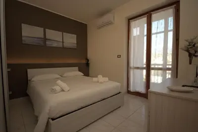 Letto o letti in una camera di Una Vita Vista Mare