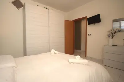 Letto o letti in una camera di Una Vita Vista Mare