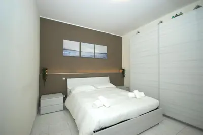 Letto o letti in una camera di Una Vita Vista Mare