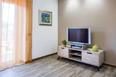 TV o dispositivi per l'intrattenimento presso Suite Giulia - Luxury apartment in the heart of Giarre