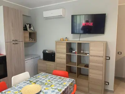 TV o dispositivi per l'intrattenimento presso Etna Beach House