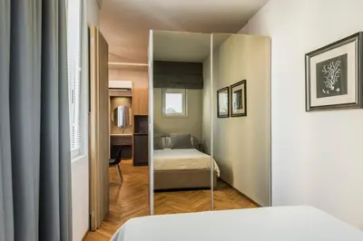Letto o letti in una camera di Ferrini Home - Ramondetta 16