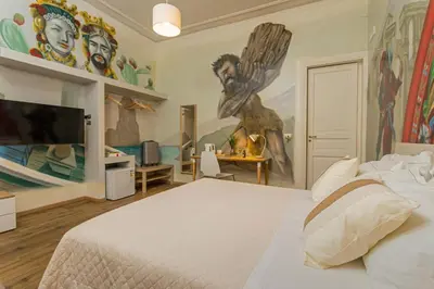 Letto o letti in una camera di Catania Urban Rooms - Artistic Design Rooms in Catania Center near Via Etnea