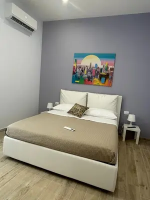 Letto o letti in una camera di Vacation Home City Center of Catania