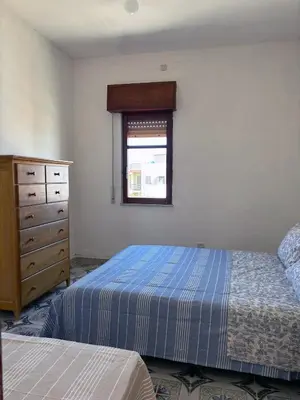 Letto o letti in una camera di Terrazza delle Acacie