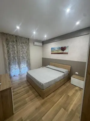 Letto o letti in una camera di EtnalanHOME