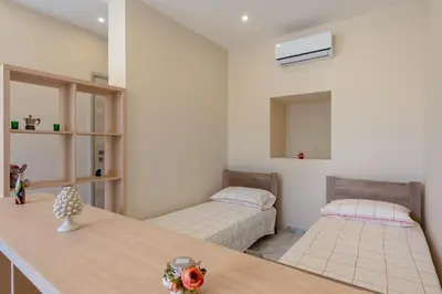 Letto o letti in una camera di GuestHost - Isole Ciclopi View - Lovely Apartment