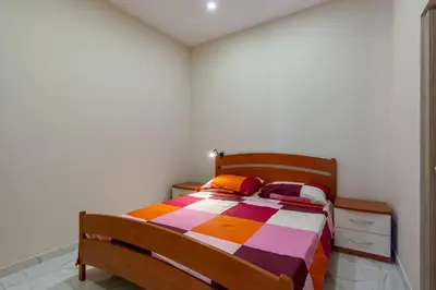 Letto o letti in una camera di GuestHost - Isole Ciclopi View - Lovely Apartment