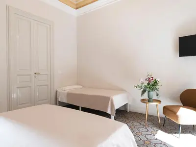 Letto o letti in una camera di Santa Filomena Historic Rooms