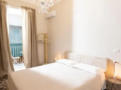 Letto o letti in una camera di Santa Filomena Historic Rooms