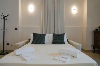 Letto o letti in una camera di RHOME Crispi LOFT