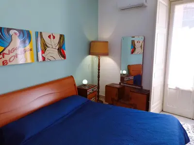 Letto o letti in una camera di Eleganti Camere in Centro a due passi dalla Stazione