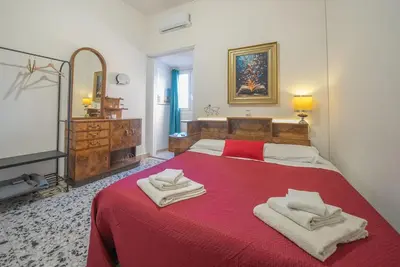 Letto o letti in una camera di Eleganti Camere in Centro a due passi dalla Stazione