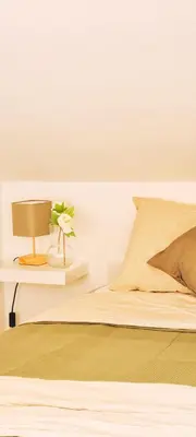 Letto o letti in una camera di La mansardina sul mare - Mascali