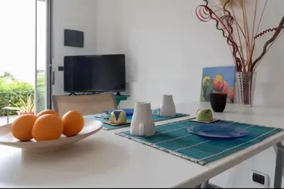 TV o dispositivi per l'intrattenimento presso Terrace Garden Apartment
