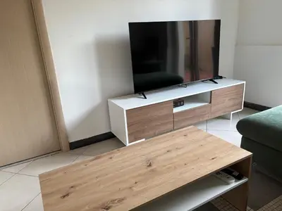 TV o dispositivi per l'intrattenimento presso Terrace Garden Apartment
