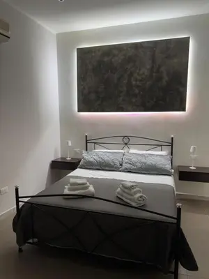 Letto o letti in una camera di A Traversa Rooms