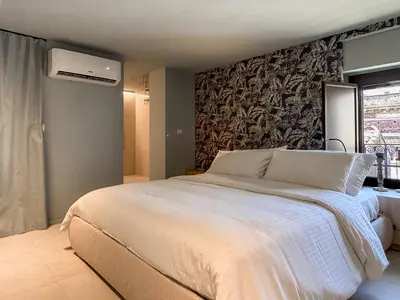 Letto o letti in una camera di Juliet Suites I