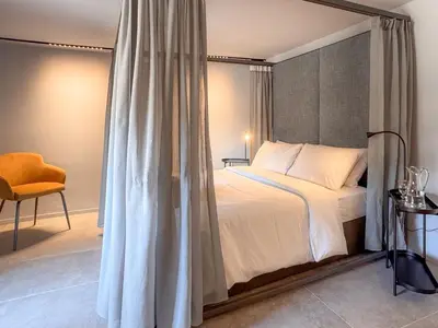 Letto o letti in una camera di Juliet Suites II