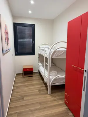 Letto o letti in una camera di SICILIA FIERA Apartment