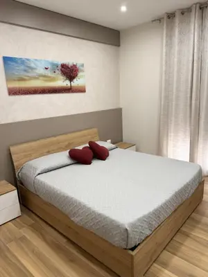 Letto o letti in una camera di SICILIA FIERA Apartment