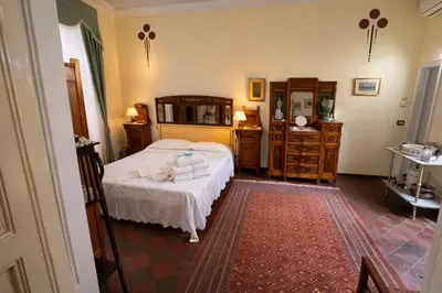 Letto o letti in una camera di Villa Storica Etna & Mare Sicily Home - Aci Bonaccorsi