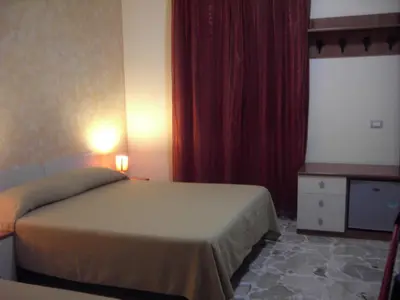 Letto o letti in una camera di Etna Inn
