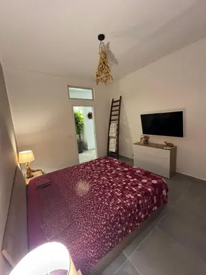 Letto o letti in una camera di Home i Due Obelischi