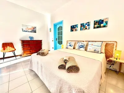 Letto o letti in una camera di Dipinto di Blu - Faraglioni Seaside Retreat