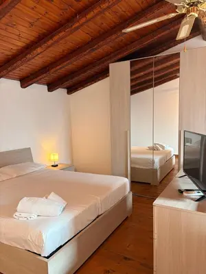 Letto o letti in una camera di Li Cuti Apartments 179
