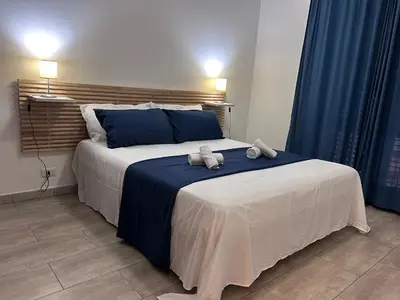 Letto o letti in una camera di Casa Vacanza I LIMONI DI SICILIA