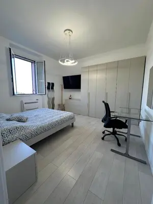 Letto o letti in una camera di Lumi Home - ApartHotel Bentivoglio