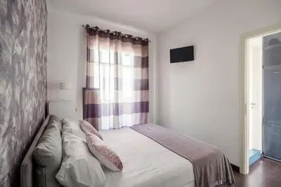 Letto o letti in una camera di FraLuci ai Faraglioni