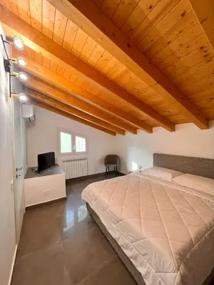 Letto o letti in una camera di Casa Dea Superior