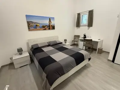 Letto o letti in una camera di DM Rooms