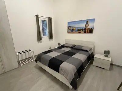 Letto o letti in una camera di DM Rooms