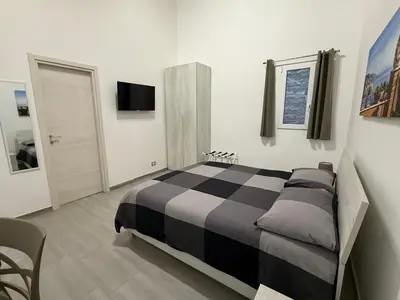 Letto o letti in una camera di DM Rooms