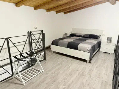 Letto o letti in una camera di DM Rooms