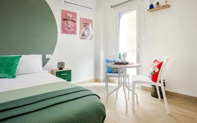 Letto o letti in una camera di JandA House - Soggiorna dove batte il cuore di Catania