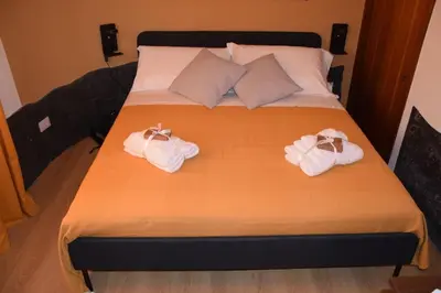 Letto o letti in una camera di Papà Vulcano - Oasi di Pietra