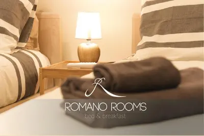 Letto o letti in una camera di Romano Rooms