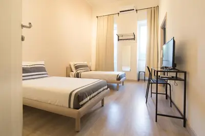Letto o letti in una camera di Romano Rooms