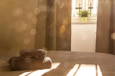 Letto o letti in una camera di Romano Rooms