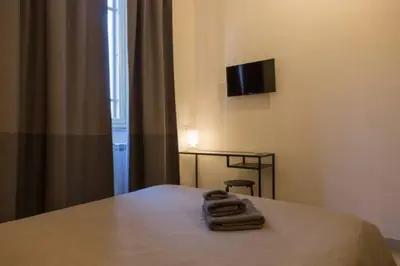 Letto o letti in una camera di Romano Rooms