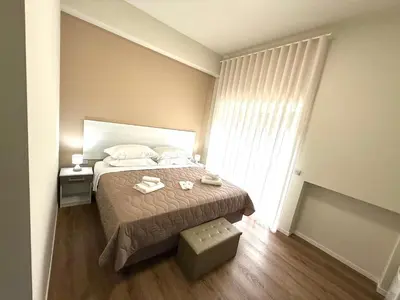 Letto o letti in una camera di B&B Ovidio