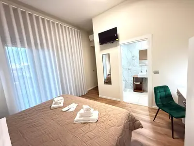 Letto o letti in una camera di B&B Ovidio