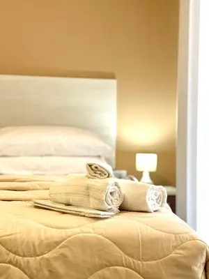 Letto o letti in una camera di B&B Ovidio