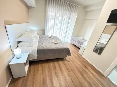 Letto o letti in una camera di B&B Ovidio