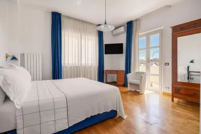 Letto o letti in una camera di Villa Rosaria